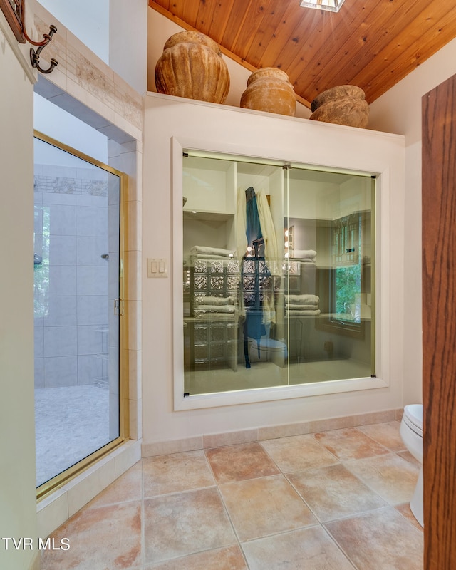 117 Lakeside Dr, Gray, TN 37615 - bathroom with lofted ceiling, wooden ceiling, a shower with shower door, tile patterned floors, and toilet