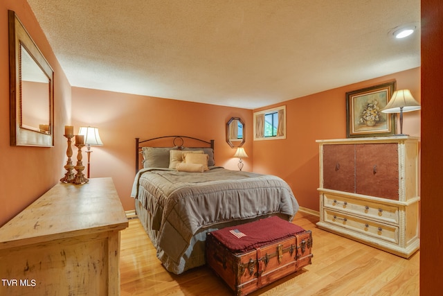117 Lakeside Dr, Gray, TN 37615 - bedroom with a textured ceiling and light wood-type flooring