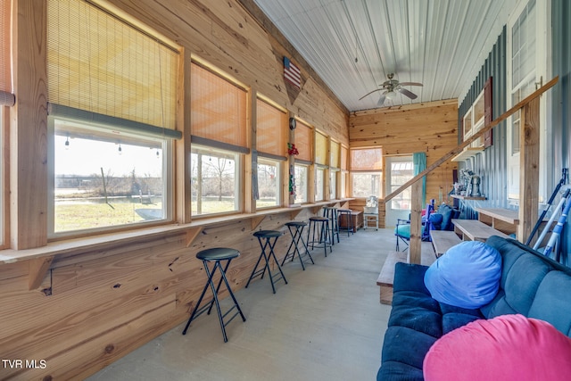 sunroom featuring ceiling fan