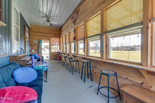 sunroom / solarium with ceiling fan