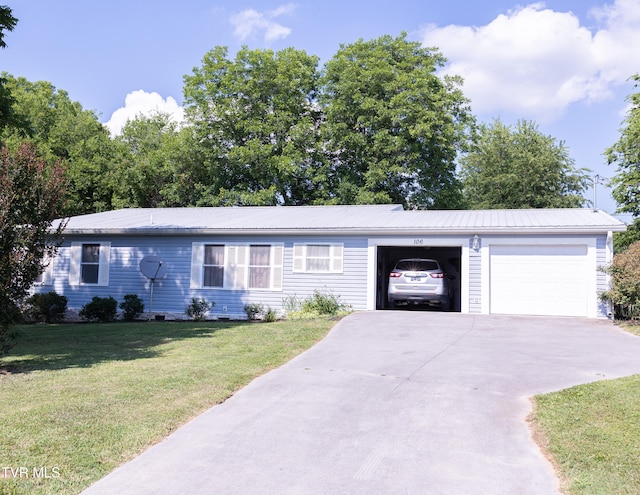 ranch-style house with a front yard and a garage