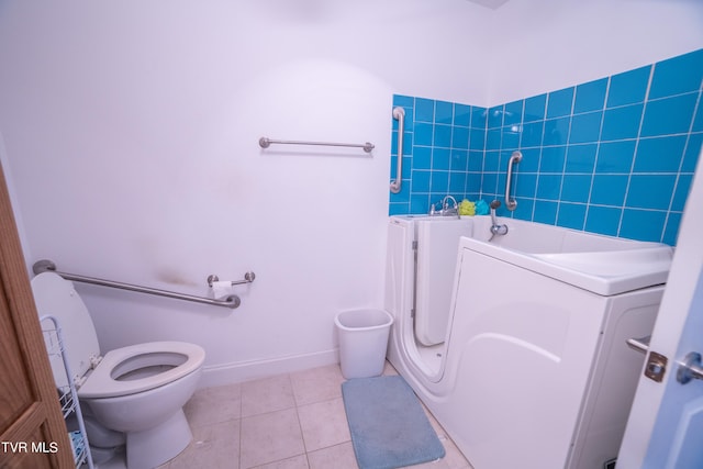 bathroom with toilet and tile floors