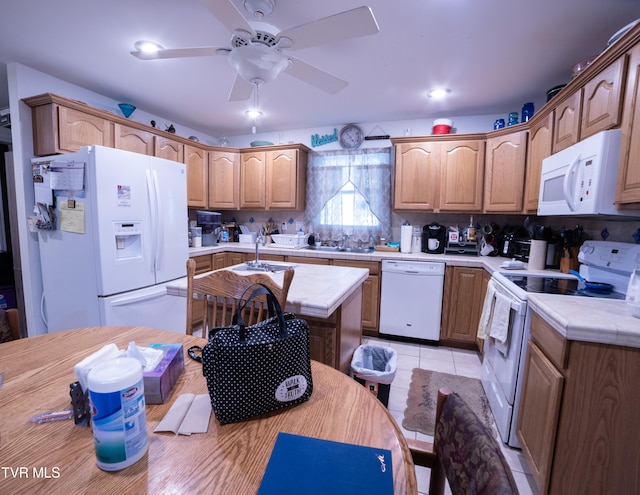 kitchen featuring ceiling fan, white appliances, backsplash, light tile floors, and a center island with sink