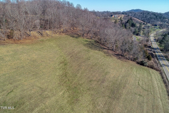 birds eye view of property with a rural view