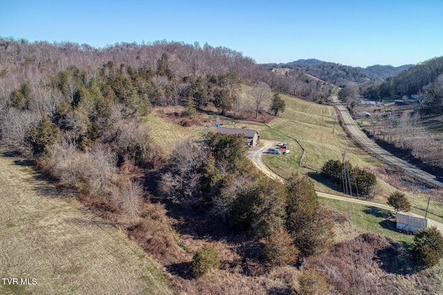 birds eye view of property with a rural view