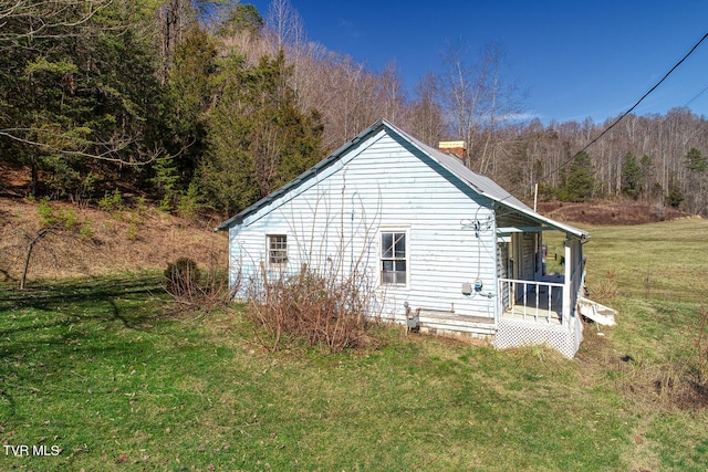 view of home's exterior with a yard