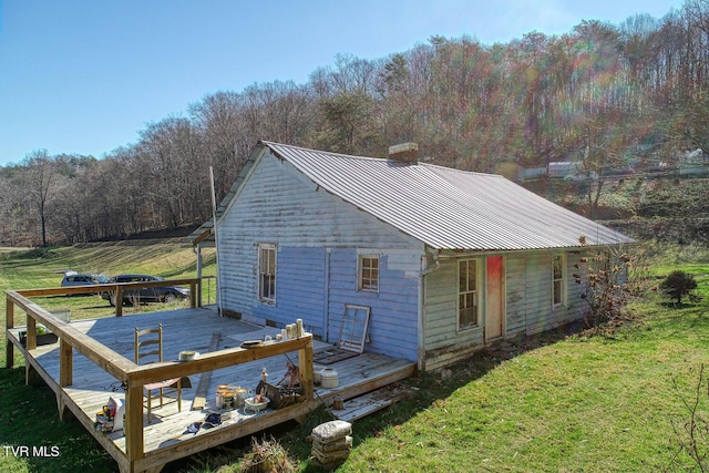 exterior space featuring a deck and a yard