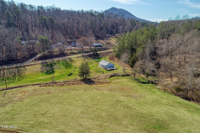 exterior space with a rural view and a mountain view