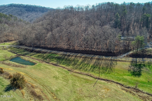 birds eye view of property featuring a rural view