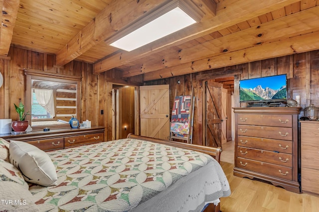 bedroom with beamed ceiling, wooden ceiling, wooden walls, and light hardwood / wood-style flooring