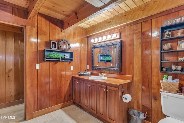 bathroom featuring beam ceiling, wood walls, wood ceiling, and toilet