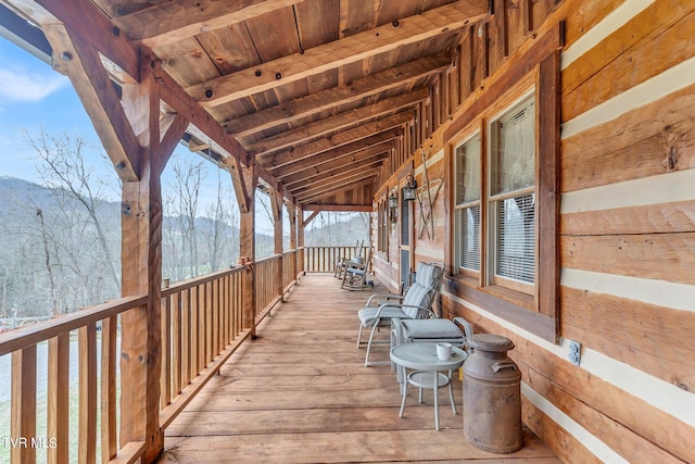 wooden terrace featuring a mountain view