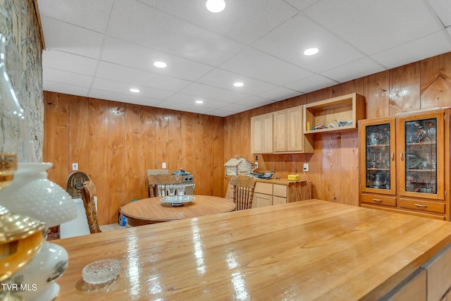 dining room featuring wooden walls