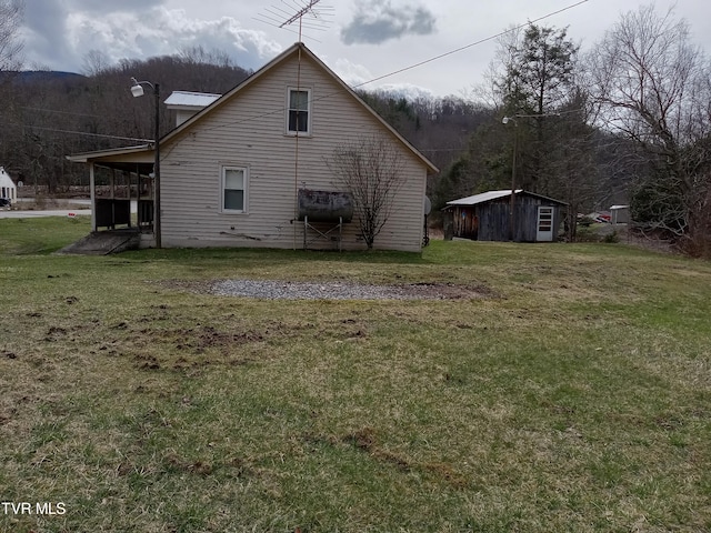 view of property exterior featuring an outdoor structure and a lawn