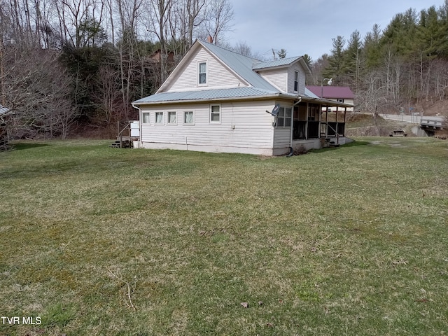 view of home's exterior featuring a lawn