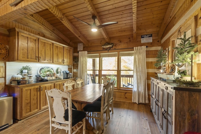 570 Stephen Brooks Rd, Greeneville, TN 37743 - dining area with wooden ceiling with exposed beams, wooden walls, light wood finished floors, and a ceiling fan