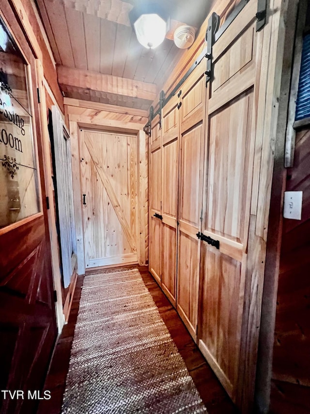 570 Stephen Brooks Rd, Greeneville, TN 37743 - detailed view of a barn door, wooden walls, wood finished floors, and wooden ceiling