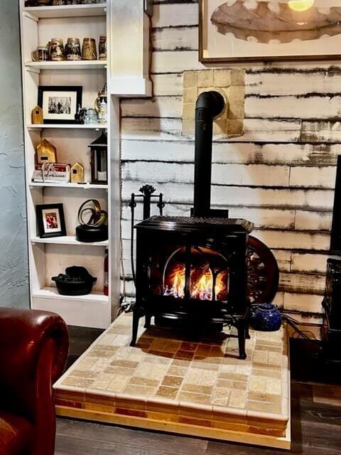 570 Stephen Brooks Rd, Greeneville, TN 37743 - detailed view of a wood stove and wood finished floors