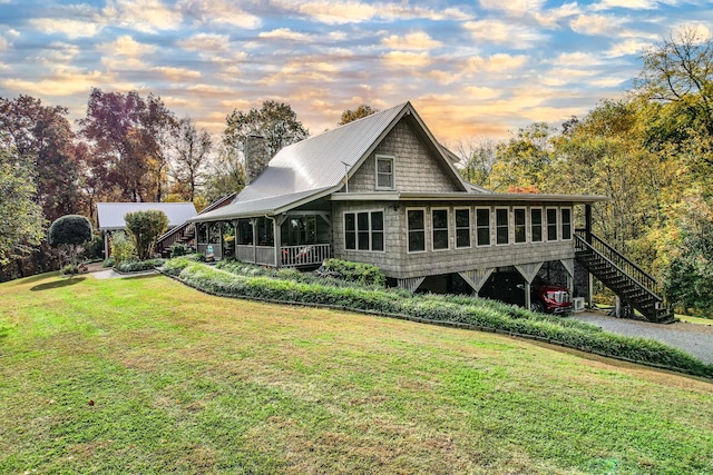 570 Stephen Brooks Rd, Greeneville, TN 37743 - rear view of house with stairs, a yard, a chimney, and a sunroom