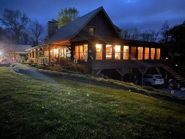 570 Stephen Brooks Rd, Greeneville, TN 37743 - rear view of house with stairway, a chimney, and a lawn