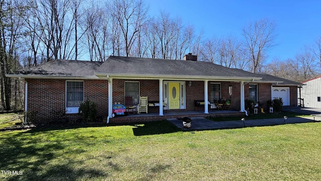 ranch-style house with a porch and a front lawn