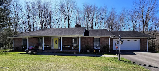 ranch-style home with a porch, a front lawn, and a garage