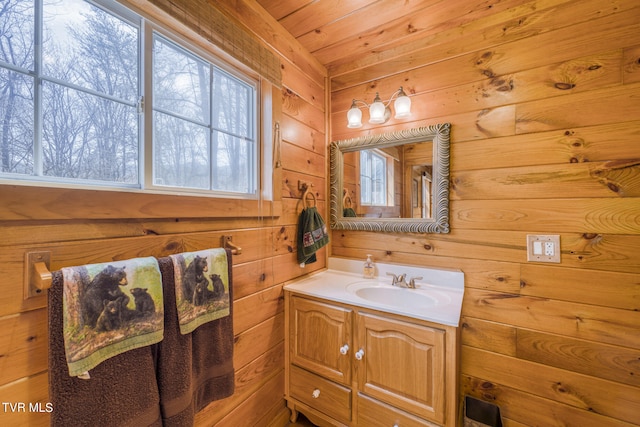 bathroom featuring wood ceiling, vanity, and wooden walls