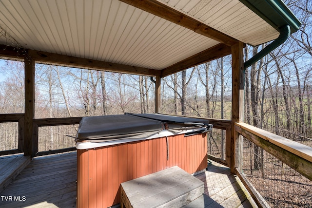 wooden terrace featuring a hot tub