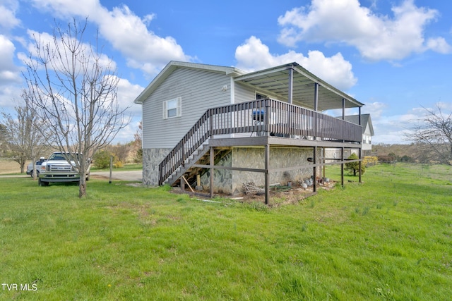 545 Mcmillian Rd, Midway, TN 37809 - rear view of house with a wooden deck and a lawn