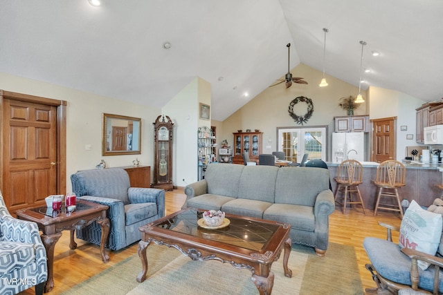 545 Mcmillian Rd, Midway, TN 37809 - living room featuring ceiling fan, light wood-type flooring, high vaulted ceiling, and french doors