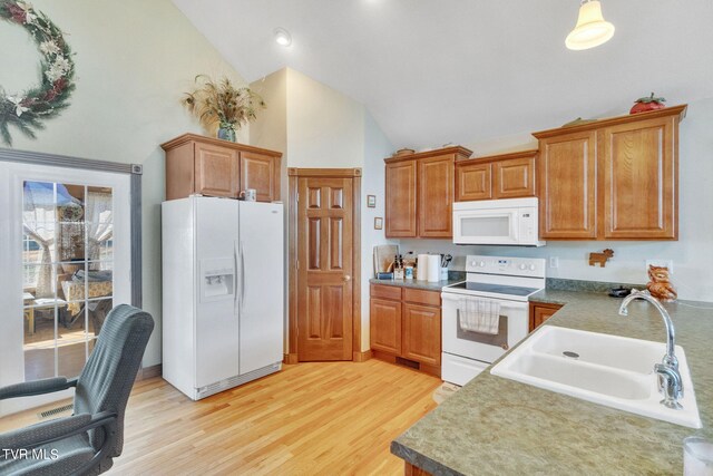 545 Mcmillian Rd, Midway, TN 37809 - kitchen with high vaulted ceiling, white appliances, light hardwood / wood-style flooring, and sink