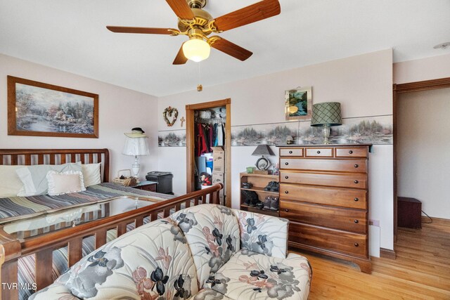 545 Mcmillian Rd, Midway, TN 37809 - bedroom with ceiling fan, a closet, and light hardwood / wood-style flooring