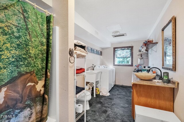 545 Mcmillian Rd, Midway, TN 37809 - interior space featuring tile flooring, washing machine and dryer, toilet, crown molding, and oversized vanity