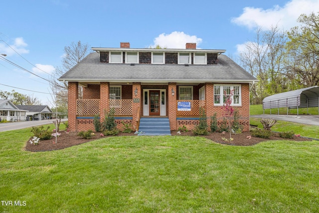 view of front of property with a carport, covered porch, and a front yard