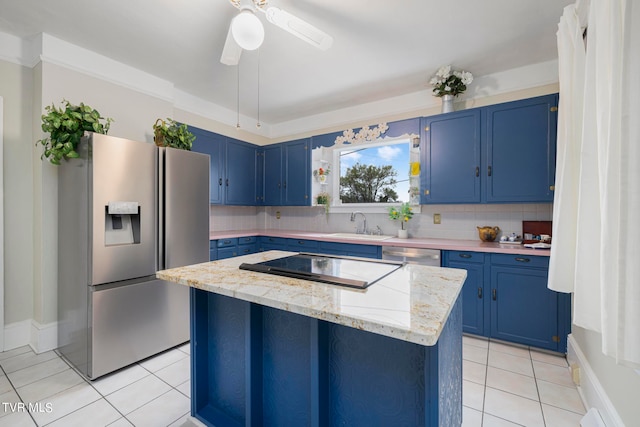 kitchen featuring blue cabinets, backsplash, stainless steel appliances, and ceiling fan