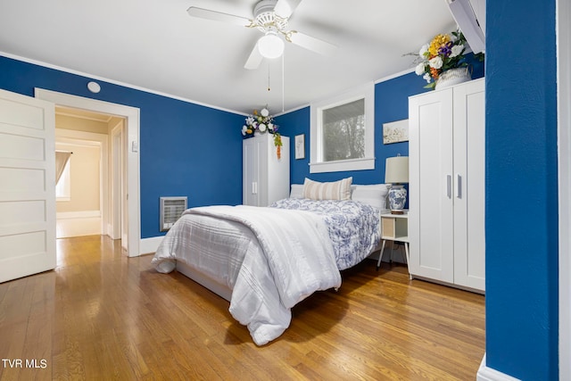 bedroom featuring ceiling fan and light hardwood / wood-style floors