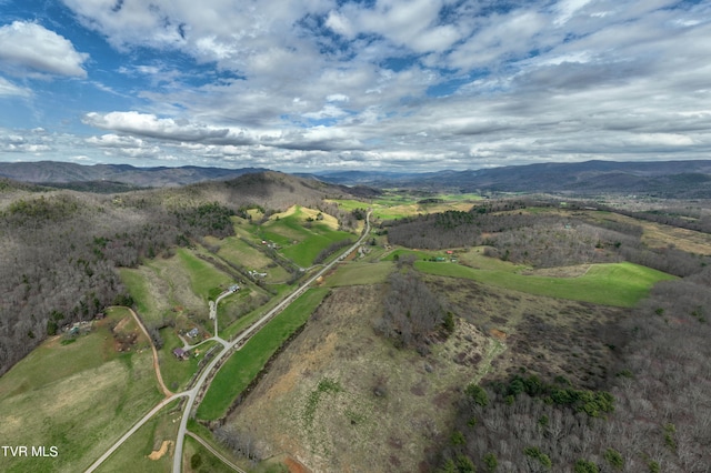 drone / aerial view featuring a mountain view