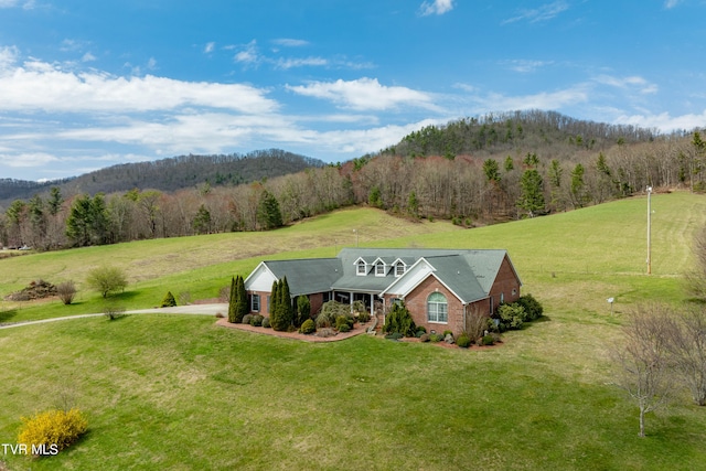 exterior space with a rural view and a front lawn