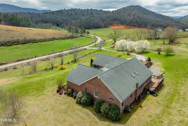 drone / aerial view with a mountain view and a rural view