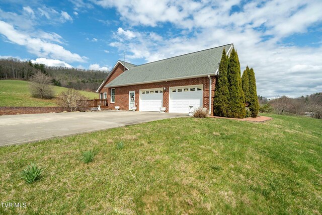 view of front of property with a front lawn and a garage