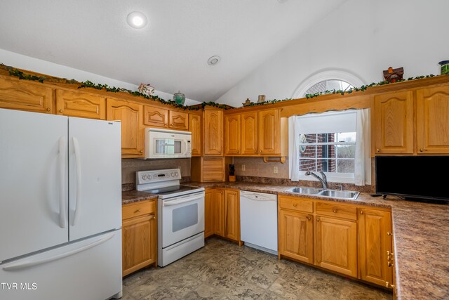 kitchen with high vaulted ceiling, light tile flooring, white appliances, backsplash, and sink