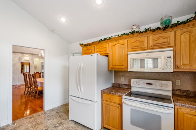 kitchen with lofted ceiling, white appliances, an inviting chandelier, light tile floors, and tasteful backsplash