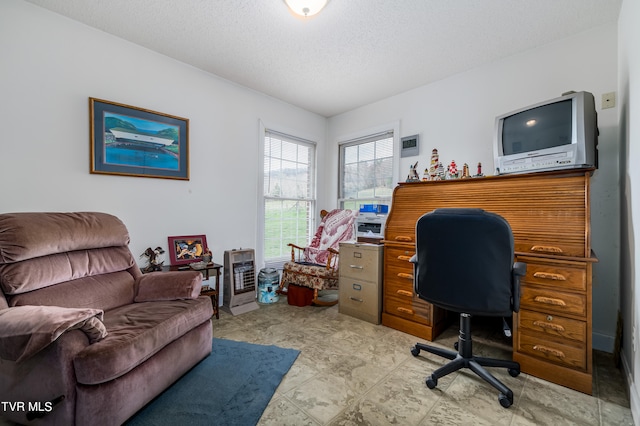 tiled home office featuring a textured ceiling