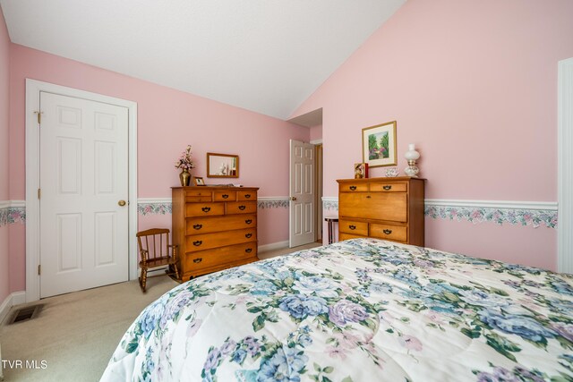 carpeted bedroom featuring high vaulted ceiling