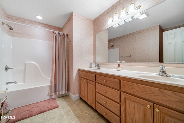 bathroom with shower / bath combination with curtain, tile flooring, a textured ceiling, and dual vanity