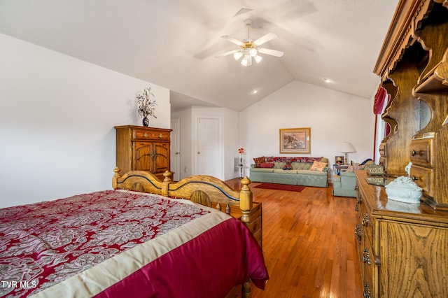 bedroom with hardwood / wood-style floors, ceiling fan, and lofted ceiling