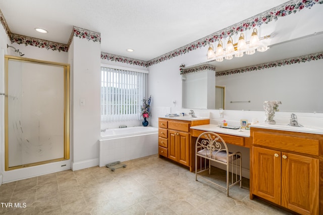 bathroom with independent shower and bath, tile flooring, dual sinks, and oversized vanity