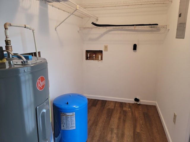 laundry area featuring water heater, hookup for a washing machine, and dark wood-type flooring