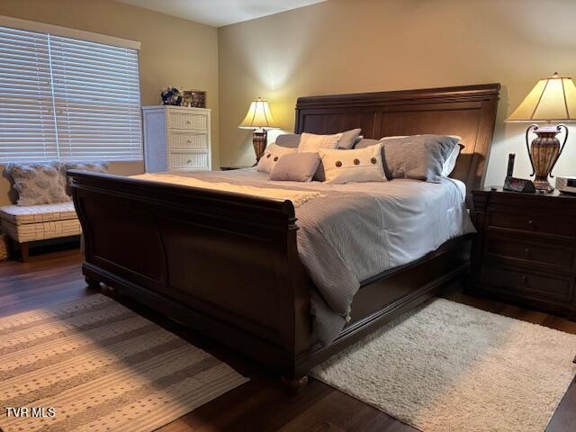 bedroom with wood finished floors