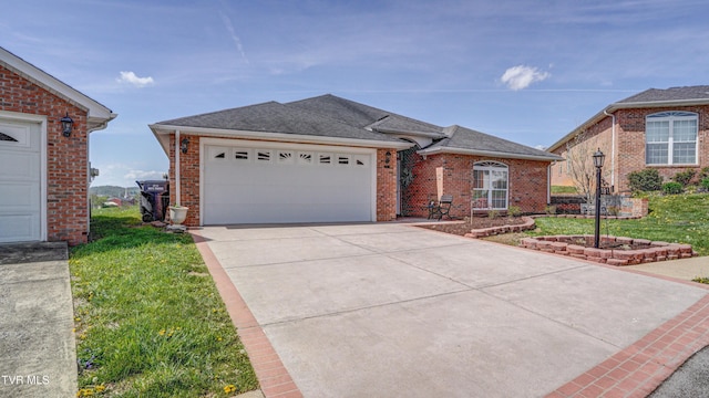 single story home featuring brick siding, driveway, roof with shingles, and an attached garage